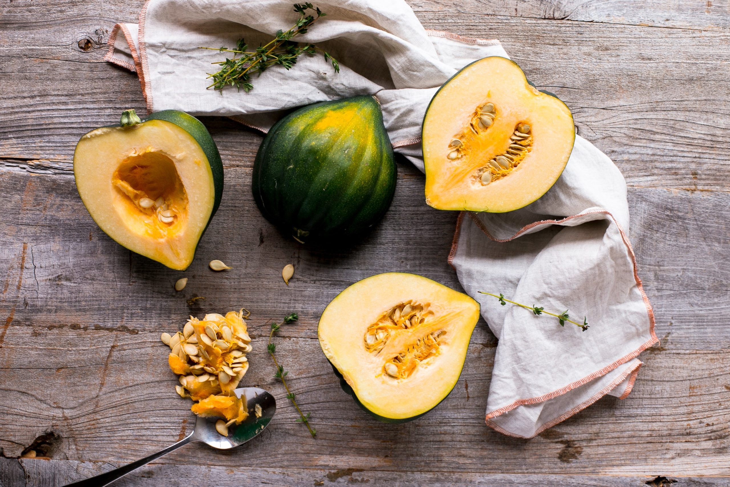 Acorn squash chopped in half. Acorn squash is a rich source of chloride and vitamin B1 in our diets.