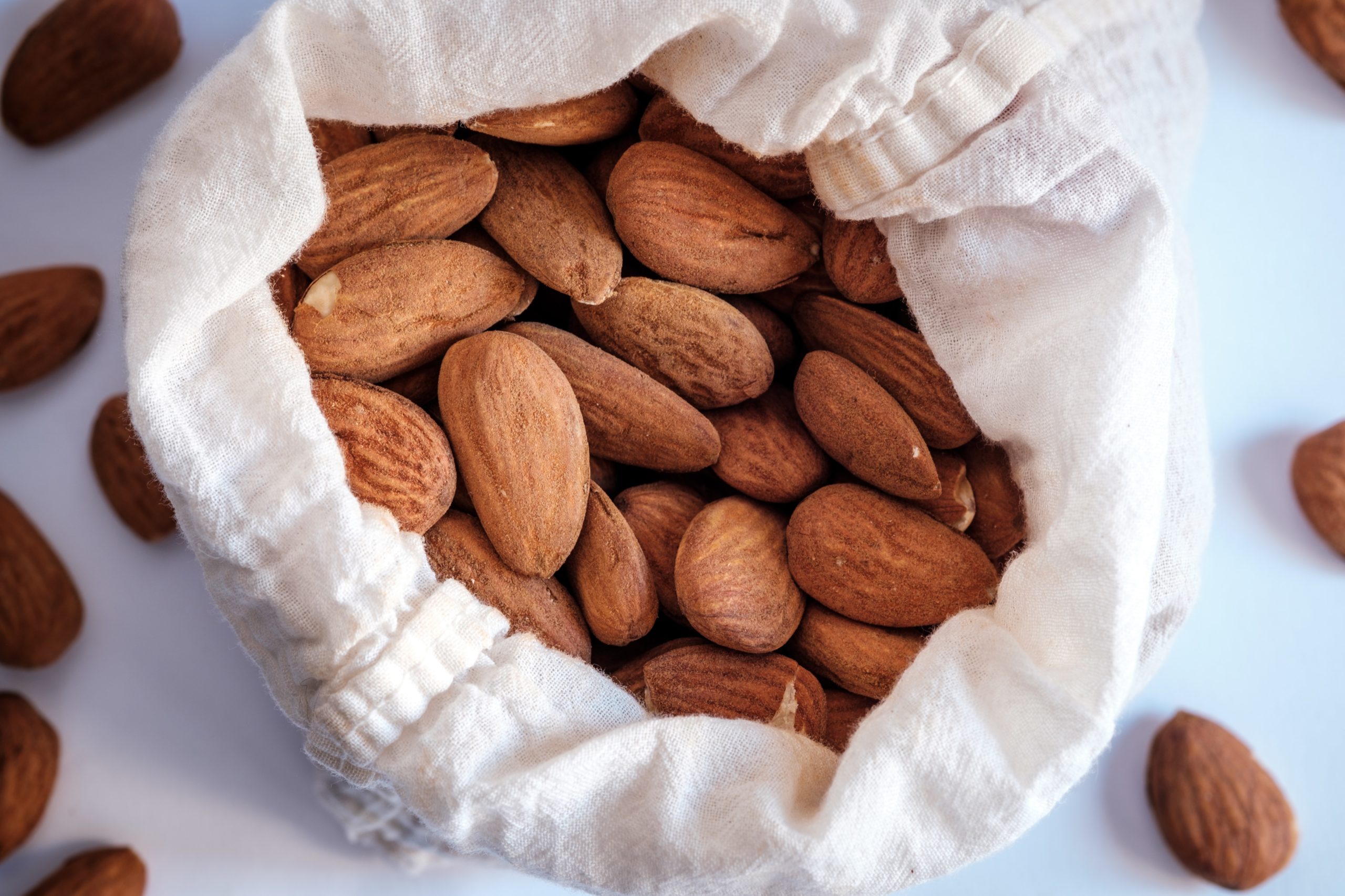 A bag of almonds. Almonds are a rich source of vitamin E, a micronutrients that our bodies need to stay healthy. Image from Unsplash.