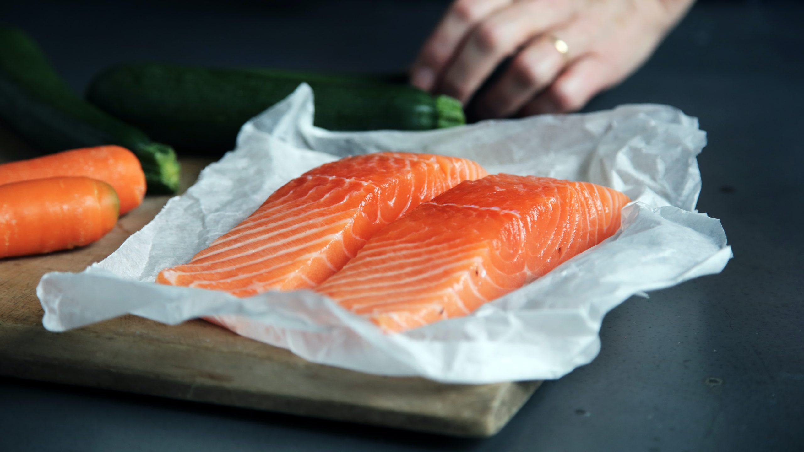 Two salmon steaks. Salmon is a great source of B vitamins, including B6, B9 and B12. Image from Unsplash.