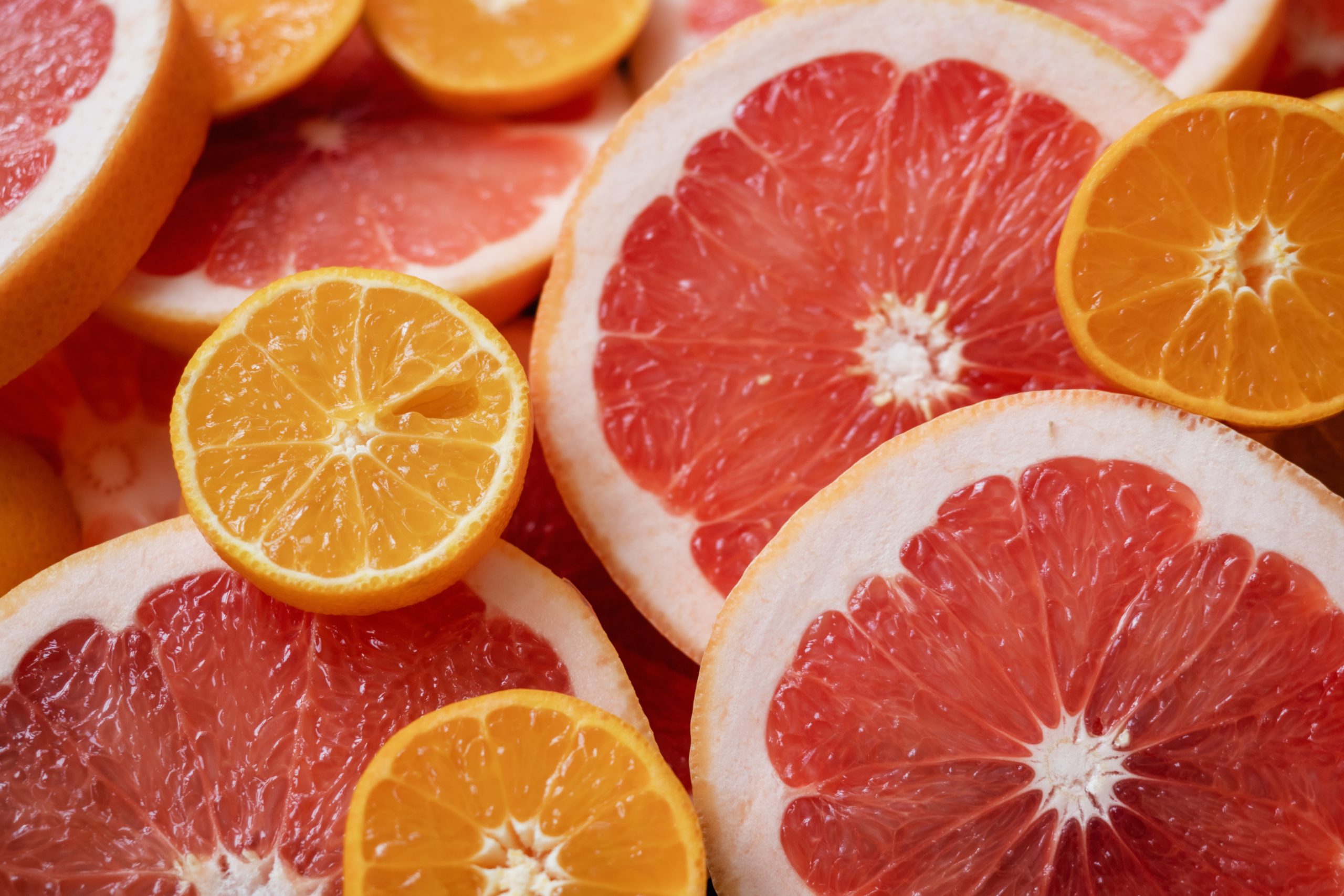 Grapefruits and oranges sliced in half. Both fruits are a great source of vitamin C which supports our immune system